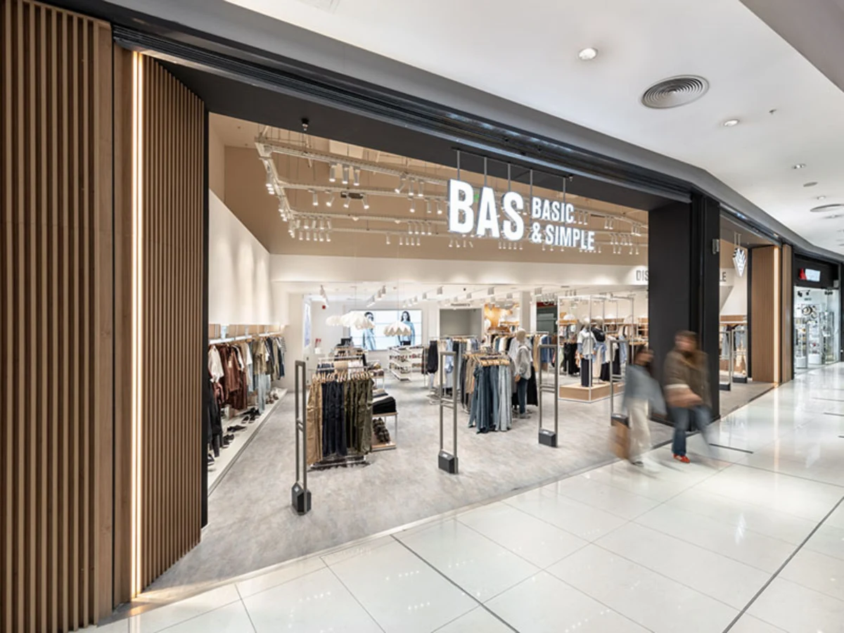 BAS Nuevo Centro - Angled view of the wide glass storefront and vertical wood slat details - Contract Workplaces.webp